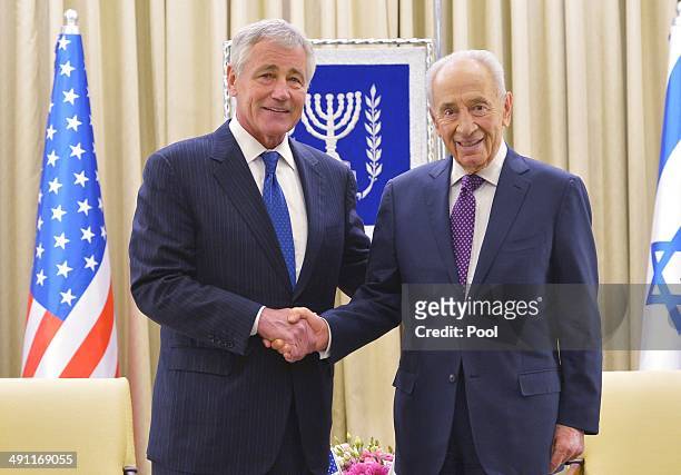 Defense Secretary Chuck Hagel poses with Israeli President Shimon Peres at the prime minister's office on May 16, 2014 in Jerusalem, Israel. Hagel is...