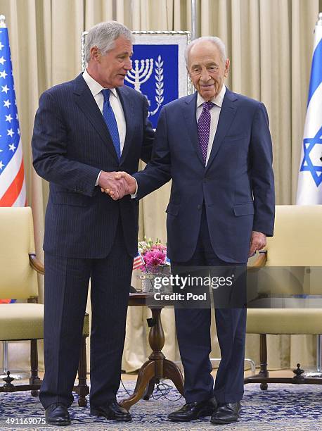 Defense Secretary Chuck Hagel poses with Israeli President Shimon Peres at the prime minister's office on May 16, 2014 in Jerusalem, Israel. Hagel is...