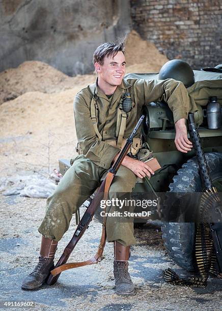 exhausted wwii army solders resting next to their jeep - us army infantry center stock pictures, royalty-free photos & images