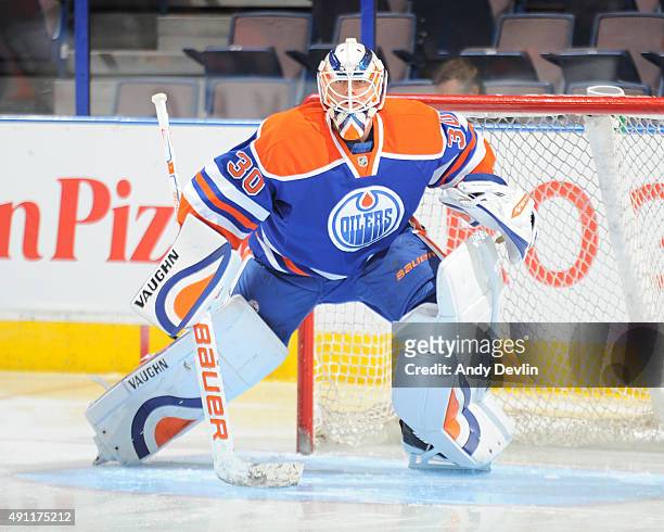 Ben Scrivens of the Edmonton Oilers warms up prior to a preseason game against the Arizona Coyotes on September 29, 2015 at Rexall Place in Edmonton,...