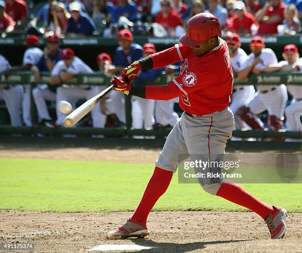 Erick Aybar of the Los Angeles Angels of Anaheim hits a solo home run in the ninth inning against the Texas Rangers at Rangers Global Life Park in...