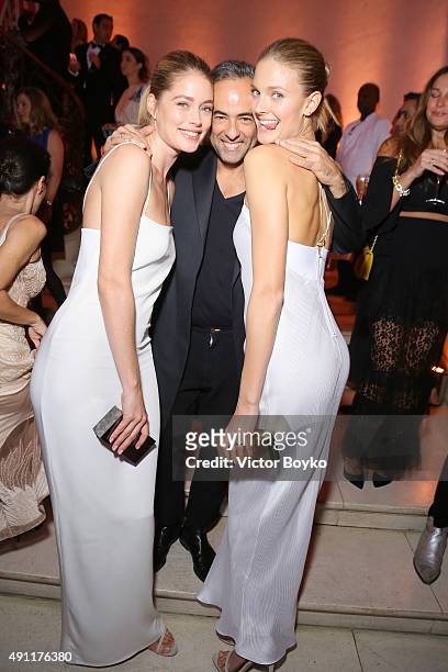 Doutzen Kroes, Francisco Costa and Constance Jablonski attend Vogue 95th Anniversary Party on October 3, 2015 in Paris, France.