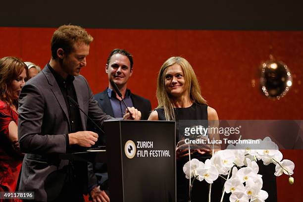 Alexander Fehling hands over the ZFF 'Austria, Germany, Switzerland Section' Award for 'Thank You for Bombing ' to director Barbara Eder at the Award...