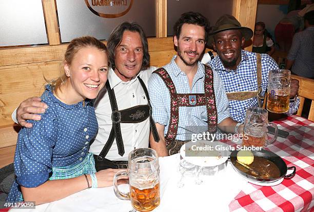 Miriam Goessner, Dr. Hans-Wilhelm Mueller-Wohlfahrt, skier Felix Neureuther and sprinter and olympic champion Usain Bolt during the Oktoberfest 2015...