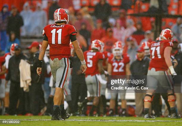 Greyson Lambert of the Georgia Bulldogs walks off the field after a failed series against the Alabama Crimson Tide at Sanford Stadium on October 3,...