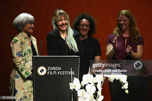 Director Betzabe Garcia is seen on stage being awarded for the Best Documentary Film for 'Kings of Nowhere' by jury president Catherine Dussart at...