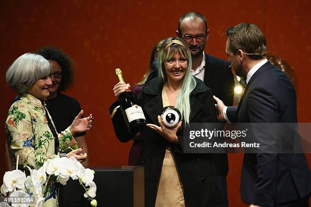 Director Betzabe Garcia is seen on stage being awarded for the Best Documentary Film for 'Kings of Nowhere' by jury president Catherine Dussart at...