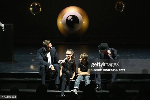 Steven Gaetjen, two children and actor Anatole Taubman speak onstage at the Award Night Ceremony during the Zurich Film Festival on October 3, 2015...
