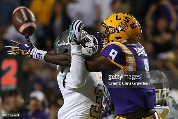 Ray Tillman of the Eastern Michigan Eagles breaks up a pass intended for John Diarse of the LSU Tigers at Tiger Stadium on October 3, 2015 in Baton...