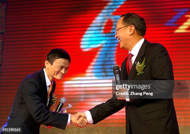 Ma Yun, President and CEO of Alibaba.com, Chinas biggest e-commerce firm founded in 1999 during a meeting with Liu Chuanzhi, President of Legend...