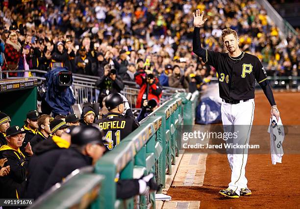 Burnett of the Pittsburgh Pirates waves to the crowd while receiving a curtain call after being pulled from the game in the 7th inning in his final...