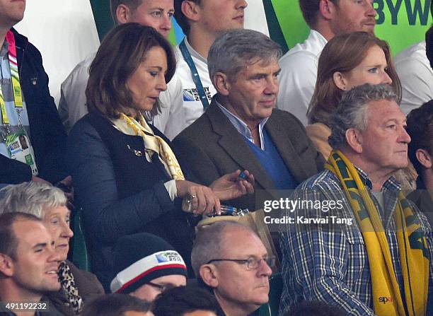 Carole Middleton and Michael Middleton attend the England v Australia match during the Rugby World Cup 2015 on October 3, 2015 at Twickenham Stadium,...