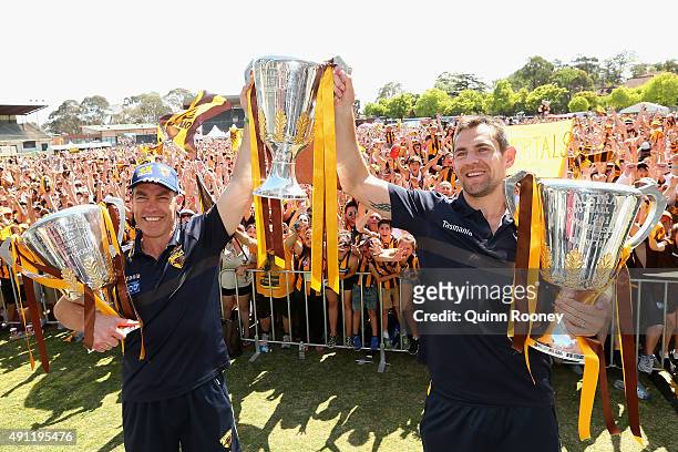 Alastair Clarkson the coach and Luke Hodge the captianHawks n the coach and Luke Hodge the captian of the Hawks pose with the 2013, 2014 and 2015...