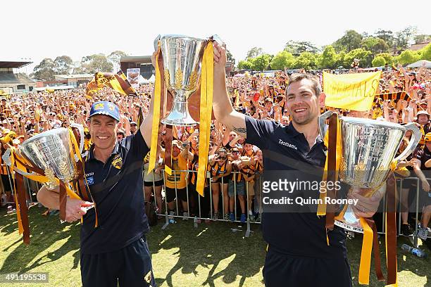 Alastair Clarkson the coach and Luke Hodge the captianHawks n the coach and Luke Hodge the captian of the Hawks pose with the 2013, 2014 and 2015...