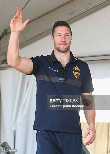 James Frawley of the Hawks waves to the crowd during the Hawthorn Hawks AFL Grand Final fan day at Glenferrie Oval on October 4, 2015 in Melbourne,...