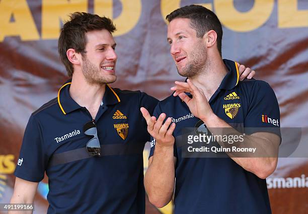 Grant Birchall and James Frawley of the Hawks celebrate during the Hawthorn Hawks AFL Grand Final fan day at Glenferrie Oval on October 4, 2015 in...