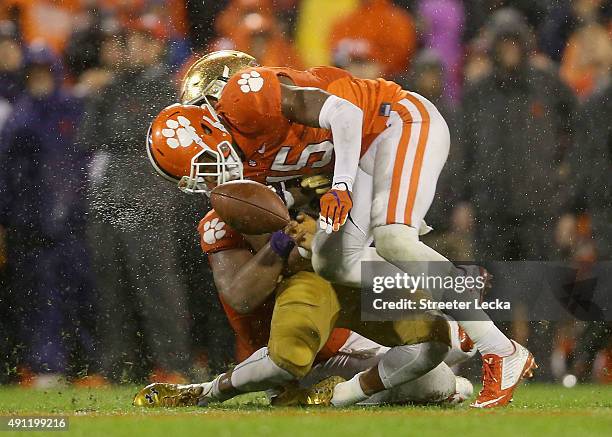 Green of the Clemson Tigers hits DeShone Kizer of the Notre Dame Fighting Irish during their game at Clemson Memorial Stadium on October 3, 2015 in...