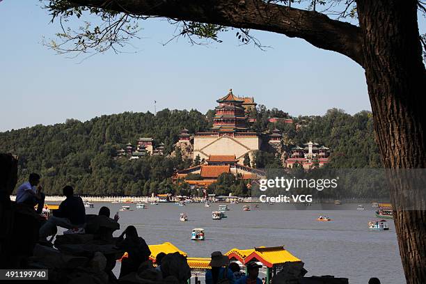 Tourists visit the Summer Palace during China's National Day holiday on October 3, 2015 in Beijing, China. 118 thousand tourists visited the Summer...