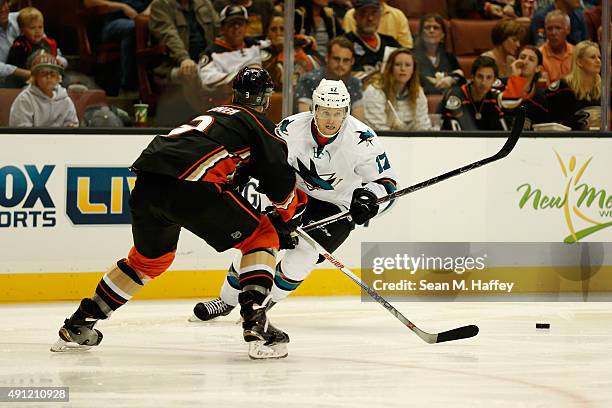 John McCarthy of the San Jose Sharks skates towards Clayton Stoner of the Anaheim Ducks in the second period of a pre season game at Honda Center on...