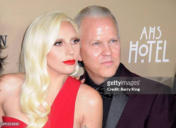 Recording Artist/actress Lady Gaga and Executive Producer Ryan Murphy arrive at the premiere screening Of FX's 'American Horror Story: Hotel' at...
