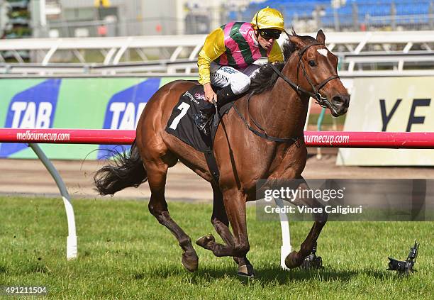 Dwayne Dunn riding Let's Make Adeal wins Race 6, the Bart Cummings during Turnbull Stakes Day at Flemington Racecourse on October 4, 2015 in...