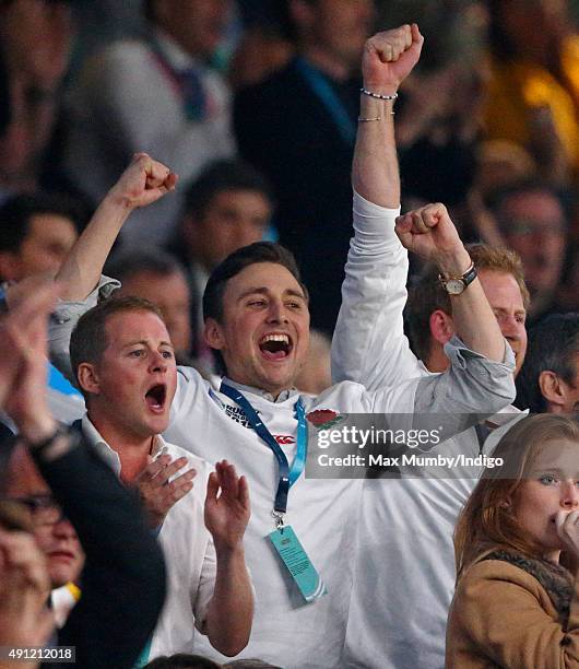 Guy Pelly, Charlie van Straubenzee and Prince Harry attend the England v Australia match during the Rugby World Cup 2015 at Twickenham Stadium on...