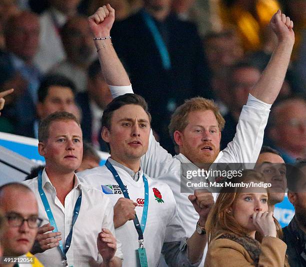 Guy Pelly, Charlie van Straubenzee and Prince Harry attend the England v Australia match during the Rugby World Cup 2015 at Twickenham Stadium on...