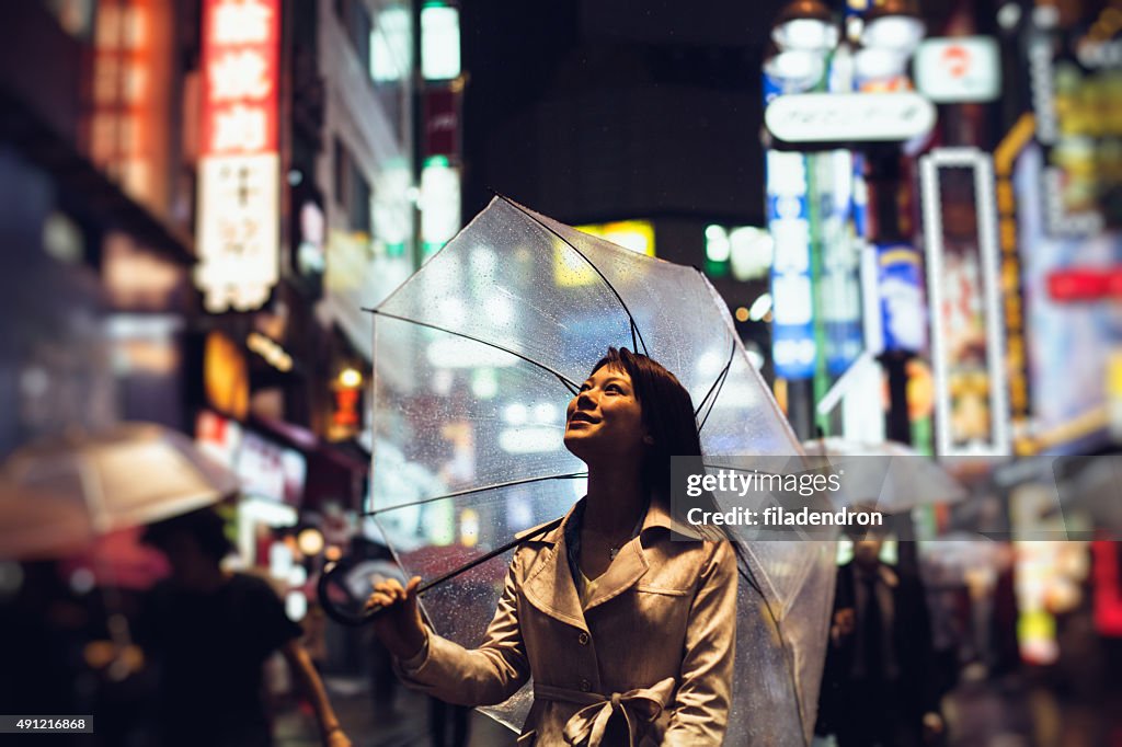 Japanese woman outside in the rain