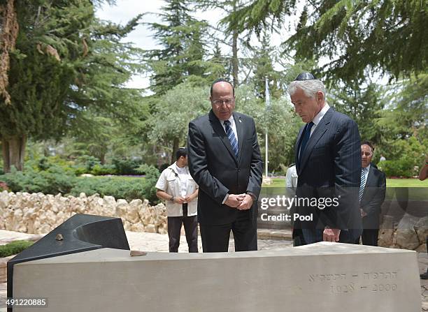 Defense Secretary Chuck Hagel and Israeli Defense Minister Moshe Ya'alon pay their respetcs at the tomb of assassinated Israeli prime minister...