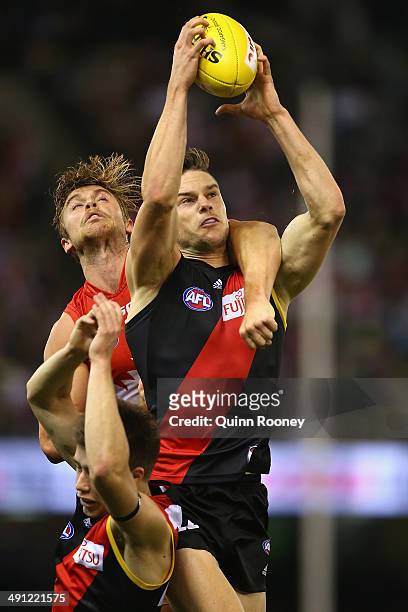 Patrick Ambrose of the Bombers marks infront of Jake Lloyd of the Swans during the round nine AFL match between the Essendon Bombers and the Sydney...