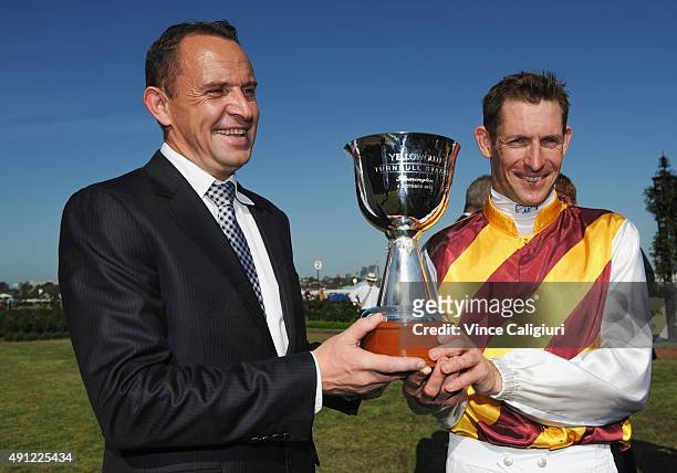 Trainer Chris Waller poses with trophy with Hugh Bowman after winning on Preferment in Race 7, the Yellowglen Turnball Stakes during Turnbull Stakes...