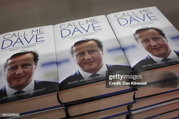 The unauthorised biography of David Cameron 'Call Me Dave' by Michael Ashcroft and Isabel Oakeshott is sold on a stand at the Conservative Party...