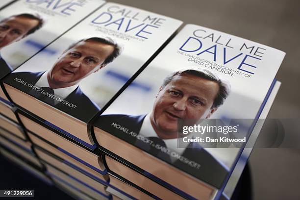 The unauthorised biography of David Cameron 'Call Me Dave' by Michael Ashcroft and Isabel Oakeshott is sold on a stand at the Conservative Party...