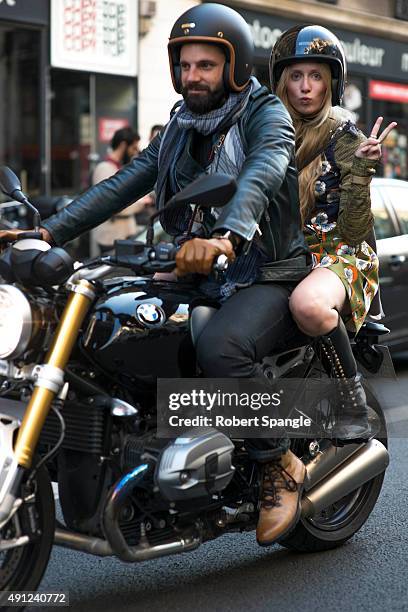 Photographer Diego Zuko wears black BLK DNM leather jacket with Blue patterned scarf by Berluti, black Zara jeans and tan Berluti hiking boots before...