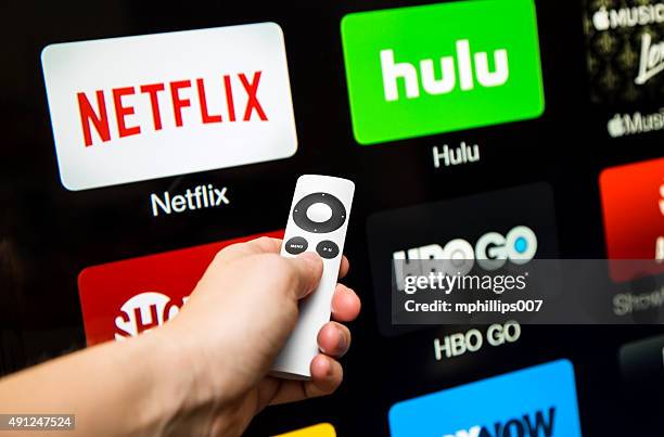 netflix app on a apple tv - streaming television stock pictures, royalty-free photos & images