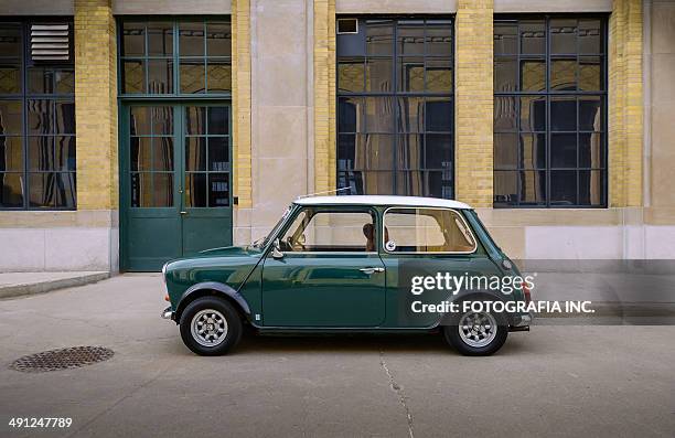 mini cooper classic in spring time - mini cooper stock pictures, royalty-free photos & images