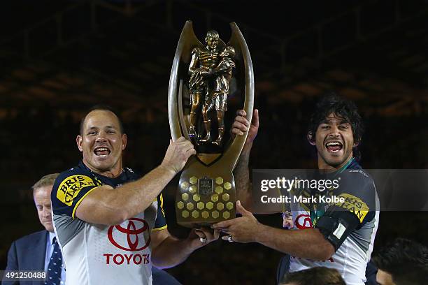 Matthew Scott and Johnathan Thurston of the Cowboys hold the Premiership trophy aloft as they celebrate victory during the 2015 NRL Grand Final match...