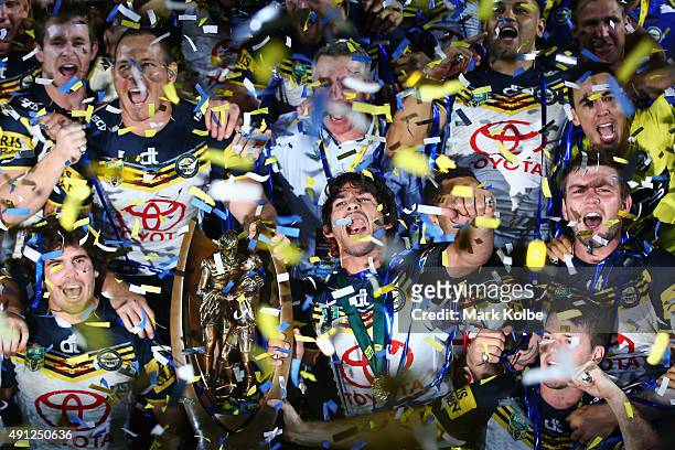 The Cowboys pose with the Premiership trophy as they celebrate victory during the 2015 NRL Grand Final match between the Brisbane Broncos and the...