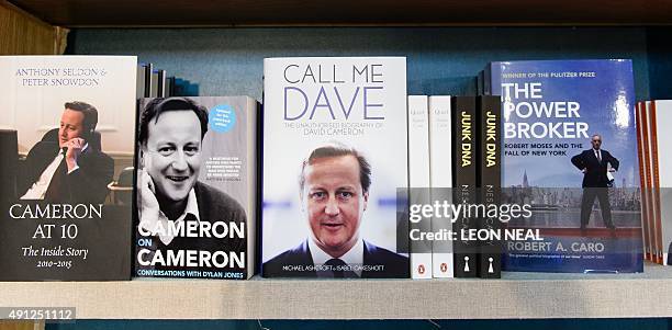 Various biographies of British Prime Minister David Cameron, including "Call Me Dave" by Michael Ashcroft and Isabel Oakeshott, are displayed in the...