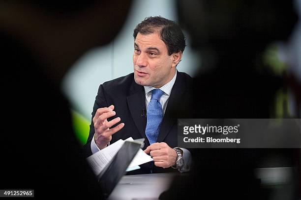 Karan Bilimoria, founder and chairman of Cobra Beer Ltd., gestures during a Bloomberg Television interview in London, U.K., on Friday, May 16, 2014....