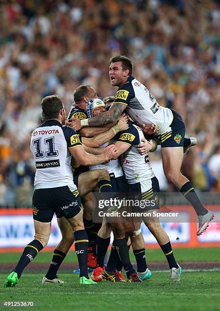 The Cowboys celebrate winning the 2015 NRL Grand Final match between the Brisbane Broncos and the North Queensland Cowboys at ANZ Stadium on October...
