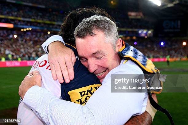 Johnathan Thurston of the Cowboys celebrates with Cowboys coach Paul Green after winning the 2015 NRL Grand Final match between the Brisbane Broncos...