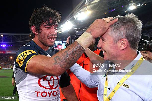 Johnathan Thurston of the Cowboys celebrates with Cowboys coach Paul Green after winning the 2015 NRL Grand Final match between the Brisbane Broncos...