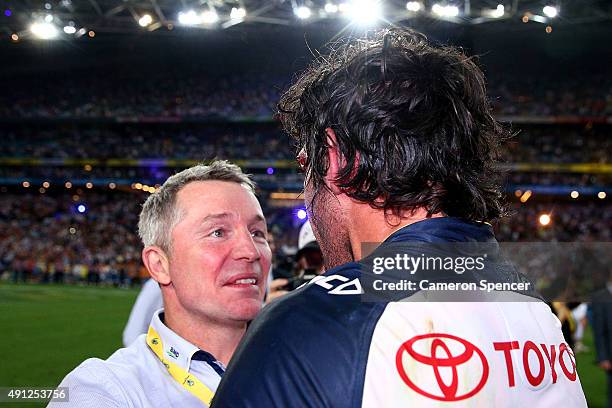 Johnathan Thurston of the Cowboys celebrates with Cowboys coach Paul Green after winning the 2015 NRL Grand Final match between the Brisbane Broncos...