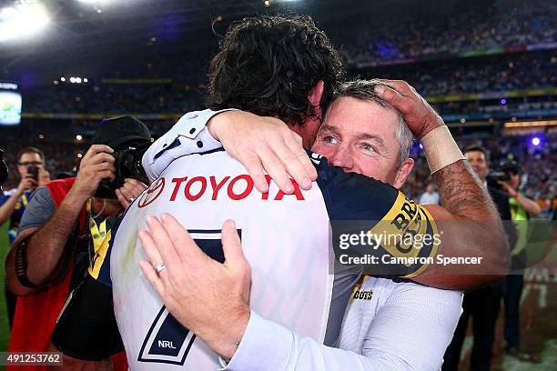 Johnathan Thurston of the Cowboys celebrates with Cowboys coach Paul Green after winning the 2015 NRL Grand Final match between the Brisbane Broncos...