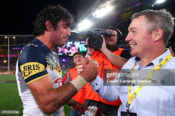 Johnathan Thurston of the Cowboys celebrates with Cowboys coach Paul Green after winning the 2015 NRL Grand Final match between the Brisbane Broncos...