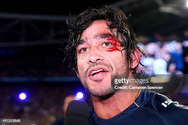 Johnathan Thurston of the Cowboys talks to the media after winning the 2015 NRL Grand Final match between the Brisbane Broncos and the North...