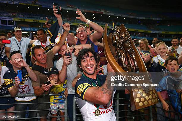 Cowboys captain Johnathan Thurston poses with the Premiership trophy after winning the 2015 NRL Grand Final match between the Brisbane Broncos and...