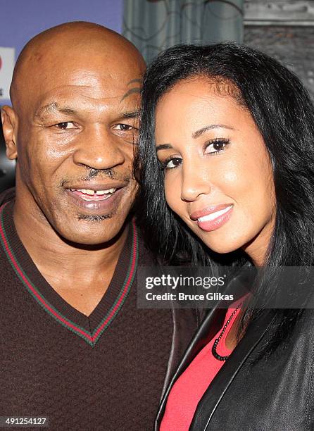 Mike Tyson and wife Kiki Tyson Tyson pose backstage at the hit musical "After Midnight" on Broadway at The Brooks atkinson Theater on May 15, 2014 in...