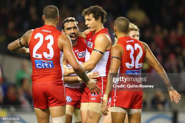 Kurt Tippett of the Swans is congratulated by Adam Goodes, Lance Franklin and Lewis Jetta after kicking a goal during the round nine AFL match...